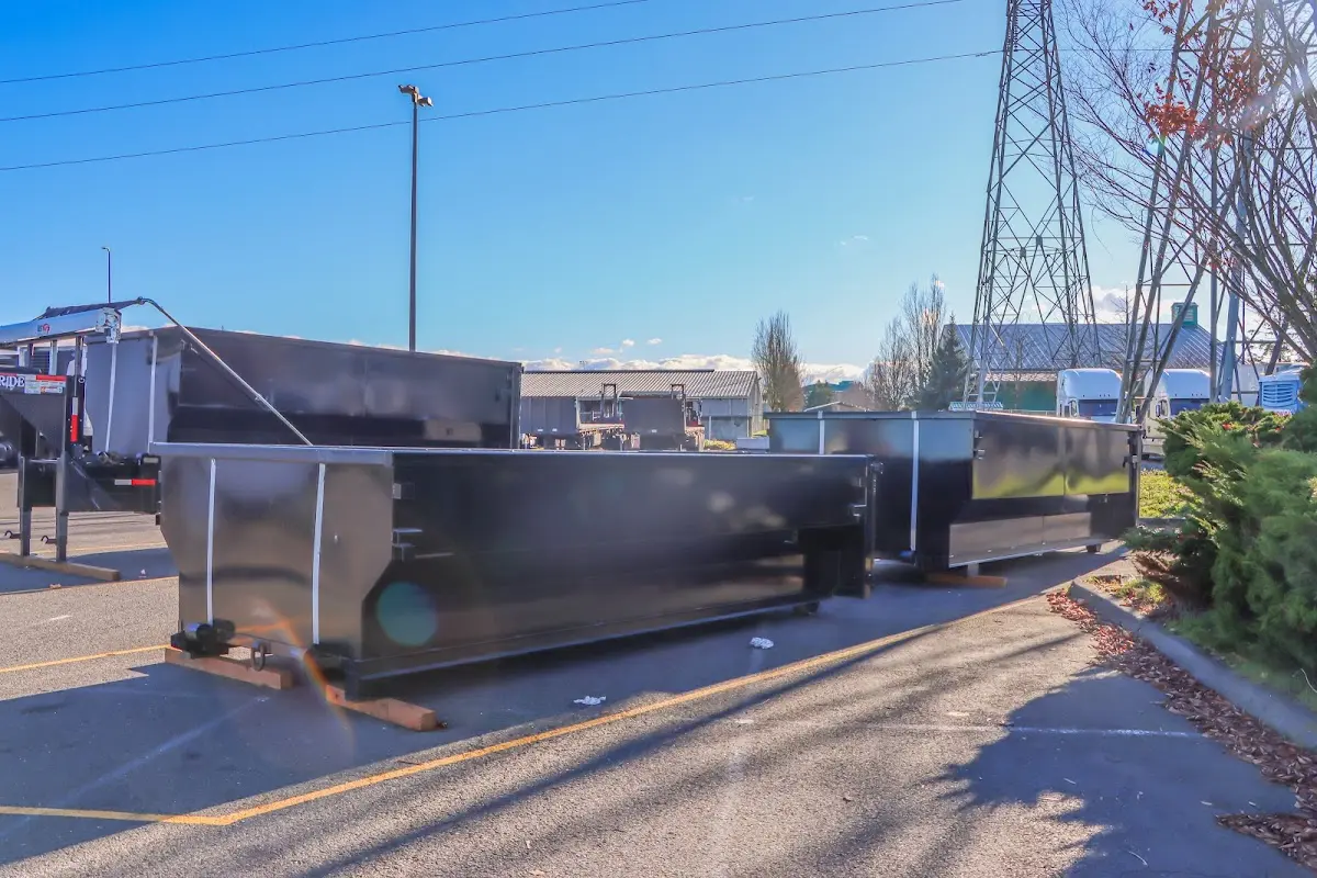 Roll-off dumpster ready for waste disposal at job site for 2 Yard Dumpster Rental in Nitro